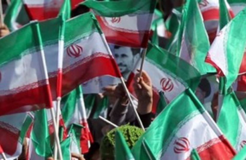 Iran flags ahmadinejad 311 (photo credit: REUTERS)