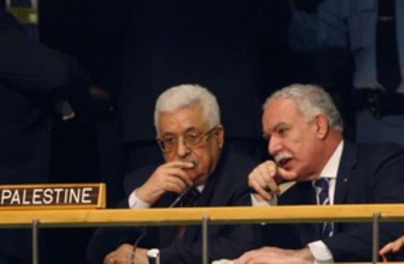 PA President Abbas with FM Riad Malki at the UN 311 (R) (photo credit: REUTERS/Jessica Rinaldi)