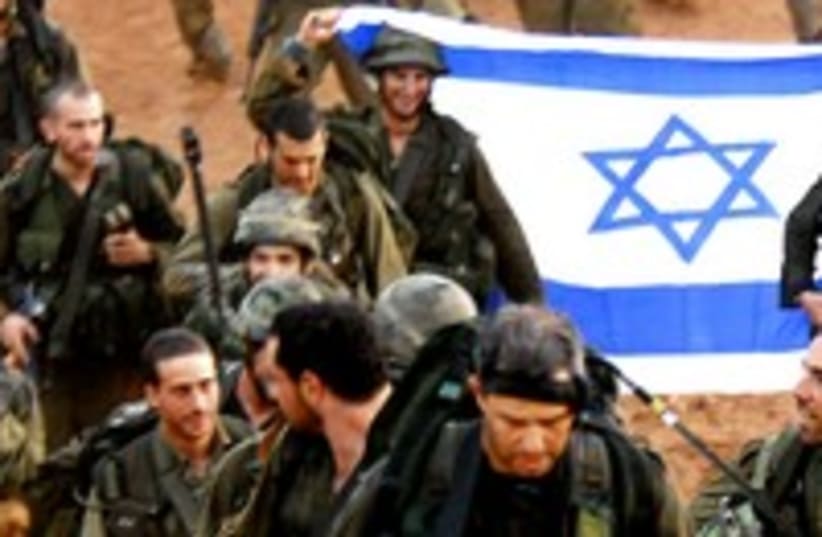 IDF soldiers march with flag 300 (photo credit: REUTERS/Dan Bronfeld)