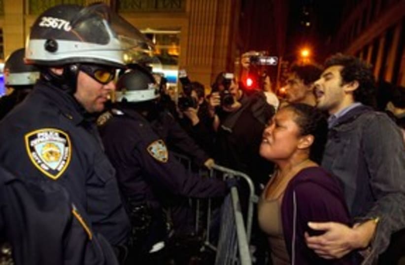 Occupy Wall Street protesters clash with NY police 311 (R) (photo credit: REUTERS/Lucas Jackson)