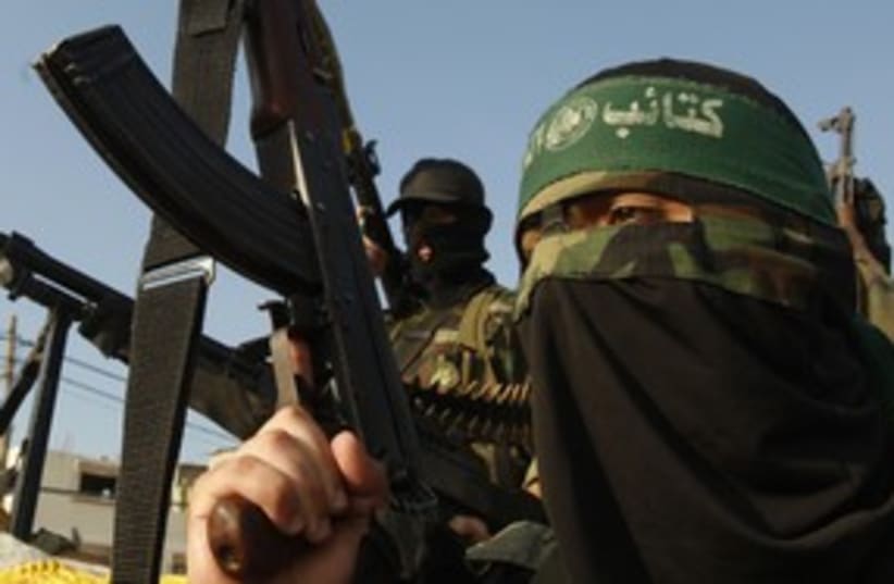 Masked Hamas terrorist 311 R (photo credit: Ibraheem Abu Mustafa / Reuters)