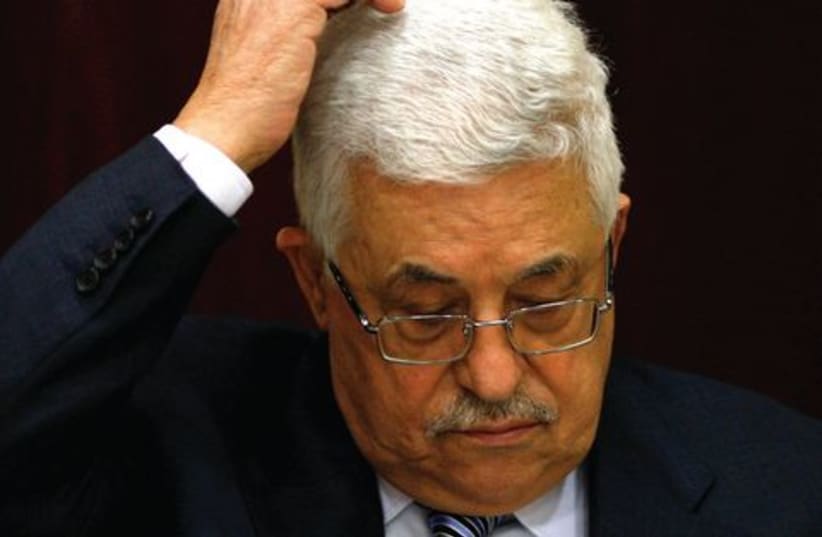 Abbas scratching head 521 (R) (photo credit: MOHAMAD YOROKMAN / REUTERS)