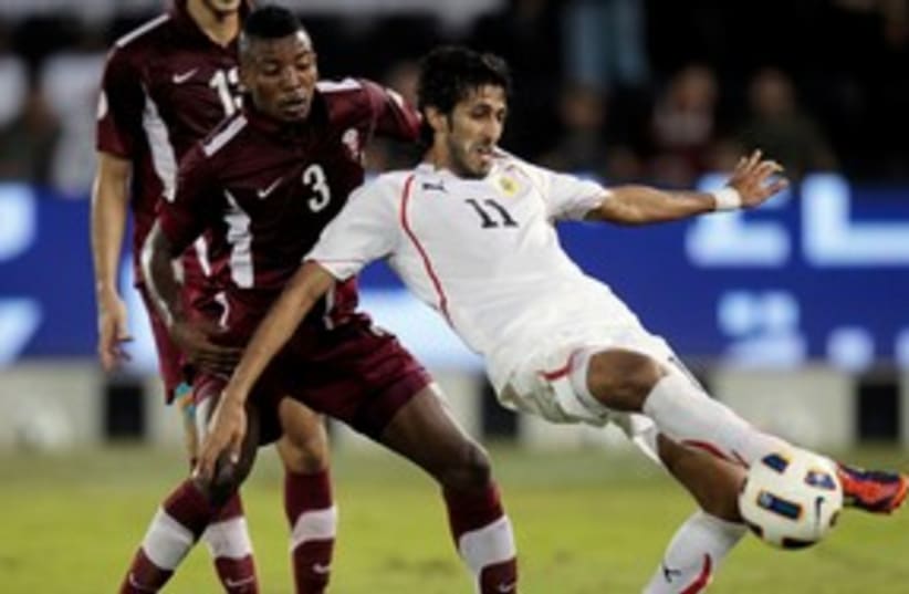 Qatar football player 311 (R) (photo credit: REUTERS/Fadi Al-Assaad)