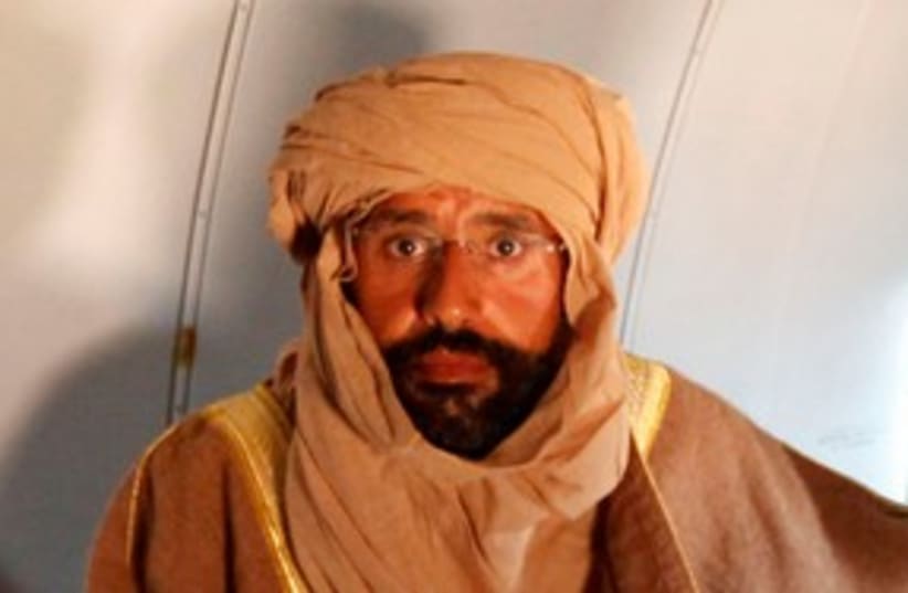 Saif al-Islam Gaddafi 311 (R) (photo credit: REUTERS/Ismail Zitouny)