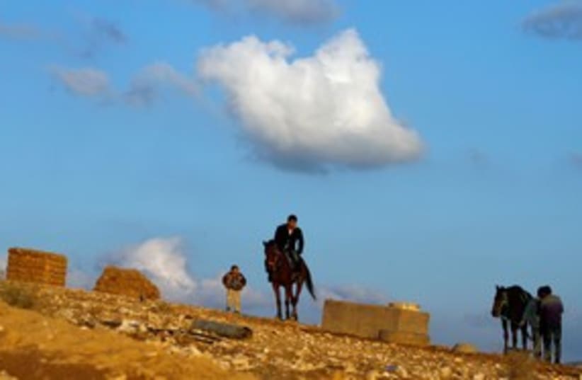 A Beduin man rides a horse in al-Arakib 311 (R) (photo credit: REUTERS/Amir Cohen)