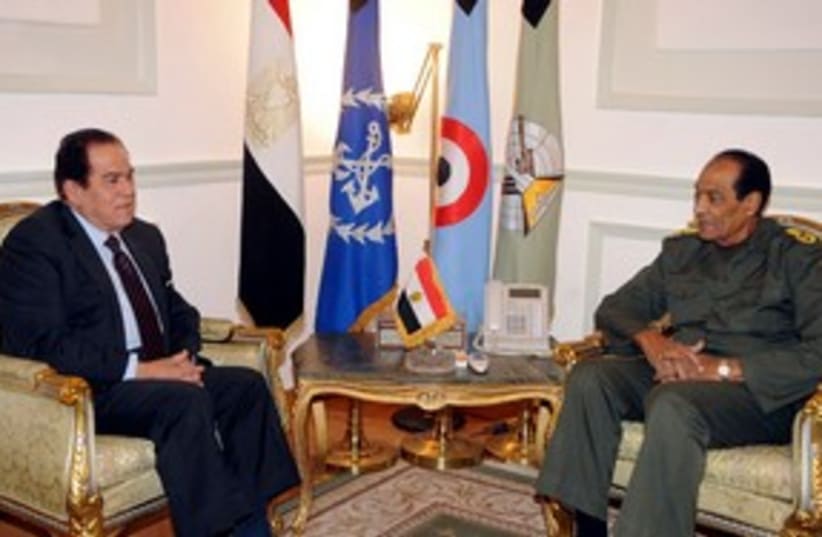 Tantawi meets with Ganzouri 311 (R) (photo credit: REUTERS/Middle East News Agency)