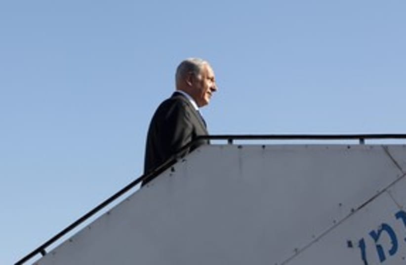 PM Netanyahu boards a plane 311 (R) (photo credit: Baz Ratner / Reuters)