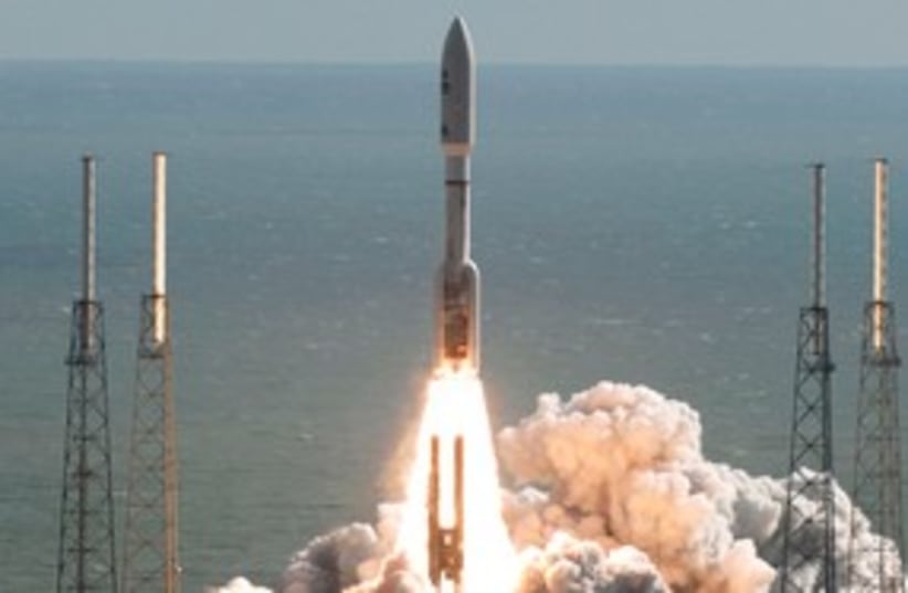 Atlas 5 rocket lifts off from the launch pad 311 (R) (photo credit: REUTERS/Michael Brown)