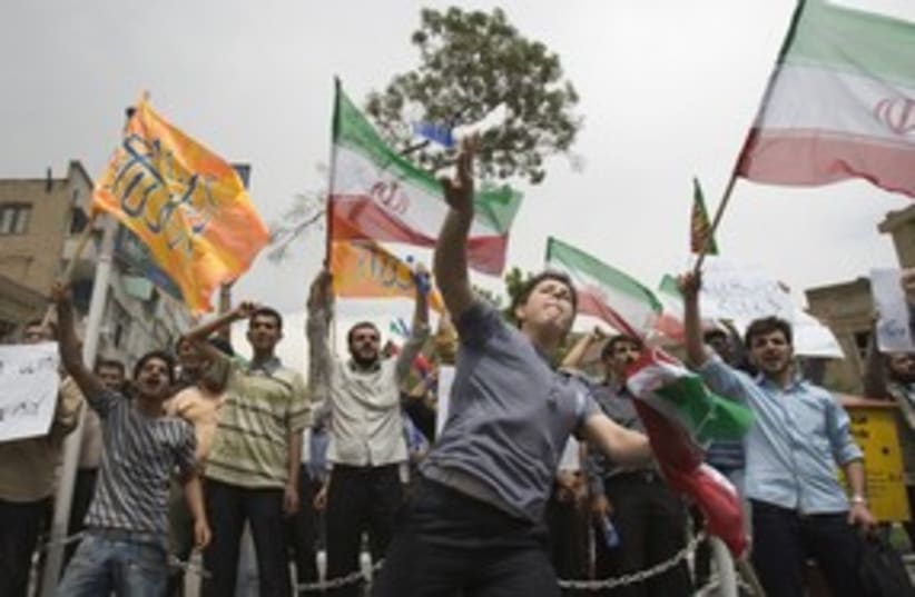 [FILE] Iranian protesters against UK 311 (photo credit: Raheb Homavandi / Reuters)