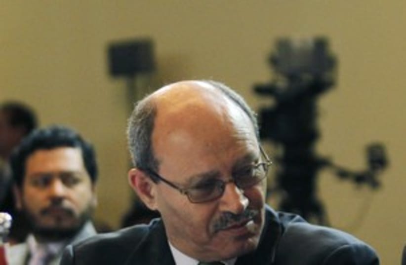 Palestinian Minister of National Economy Abu Libdeh (R) 311 (photo credit: REUTERS/Enrique Marcarian)