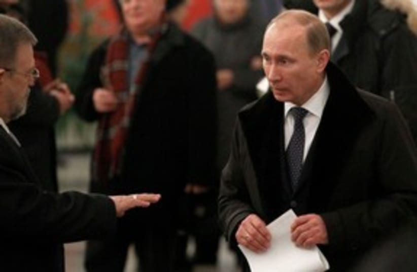 Vladimir Putin casts his vote 311 (photo credit: REUTERS)