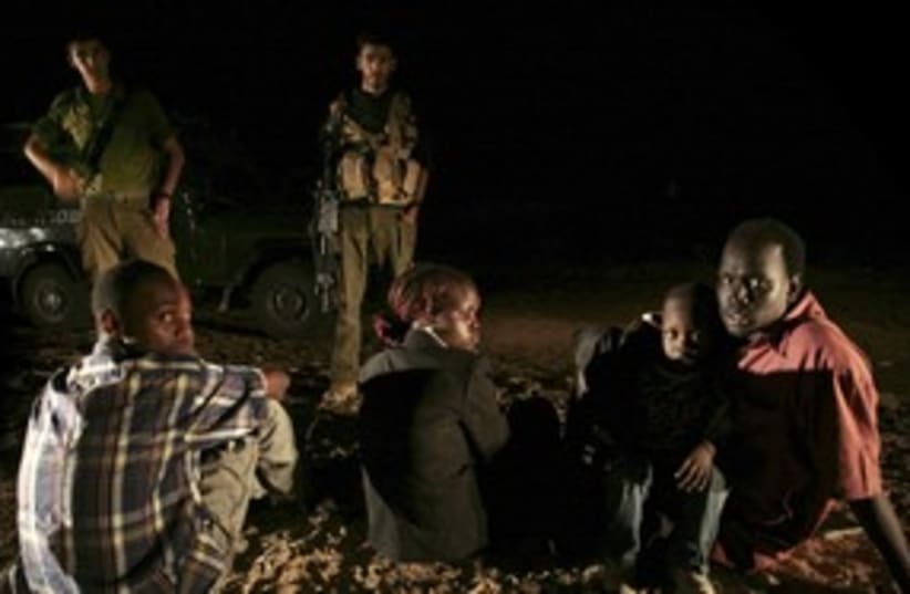 Sudanese detained after crossing southern border 311 (R) (photo credit: Yonathan Weitzman / Reuters)