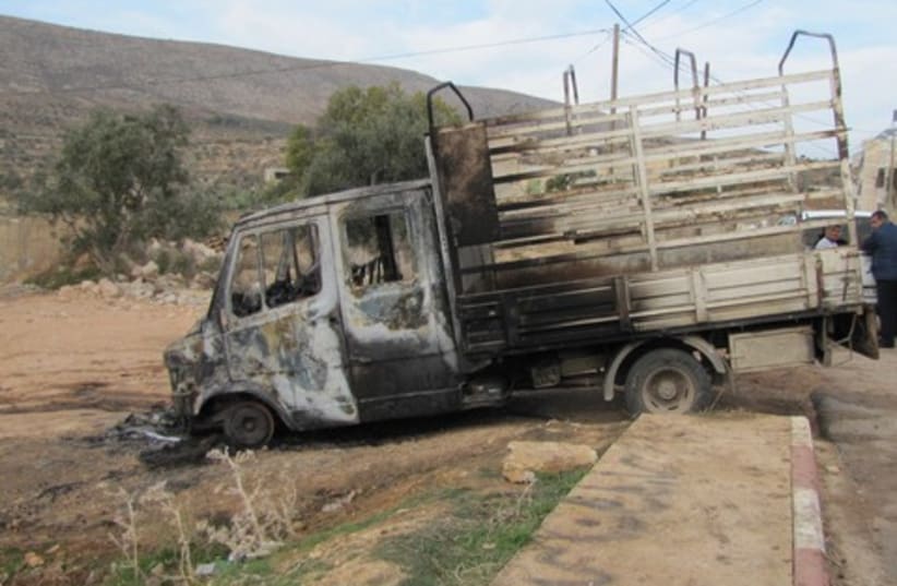 Palestinian vehicle set on fire price tag 311  (photo credit: Courtesy of Attaf Abu-Rov, B'Tselem)