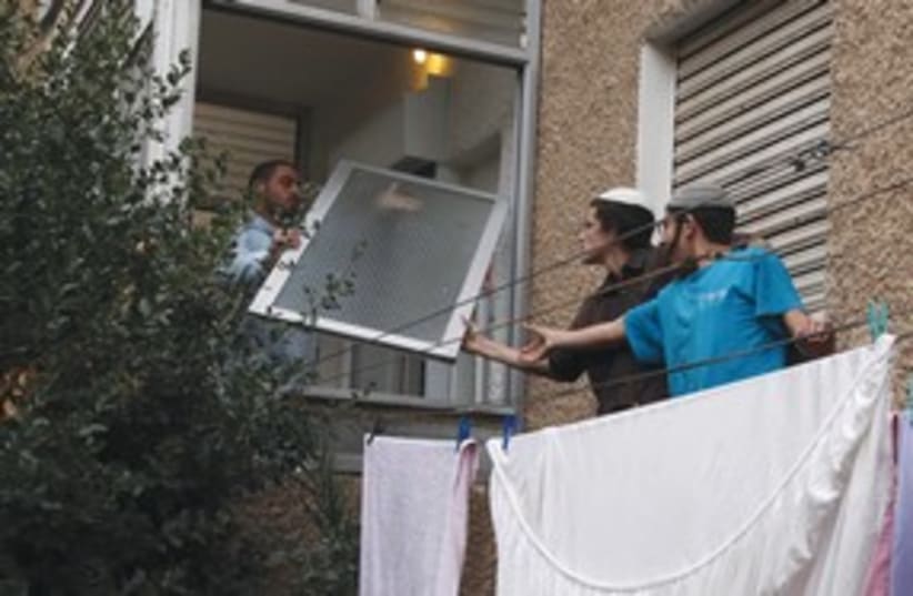 police stops activist from entering price-tag apt._311 (photo credit: marc israel sellem)