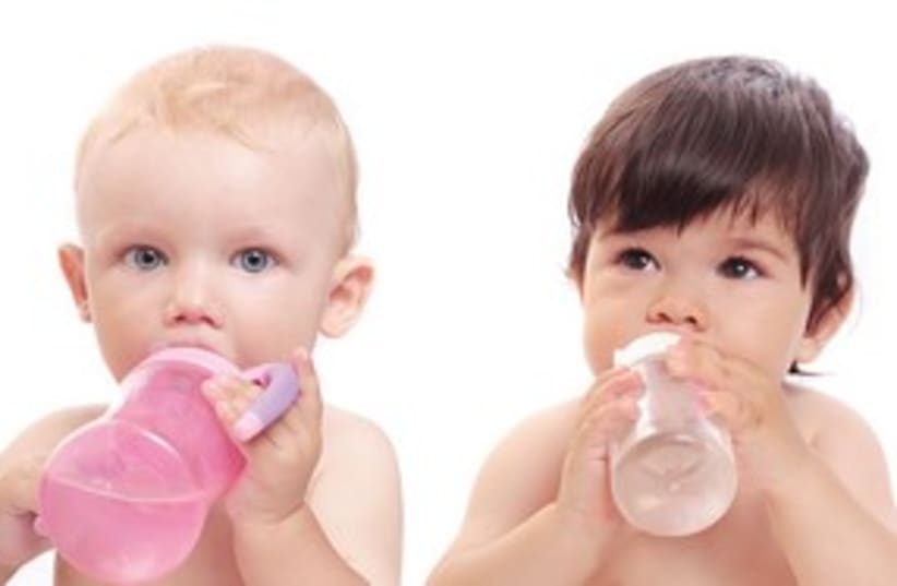 babies sucking their bottles_311 (photo credit: Shutterstock)