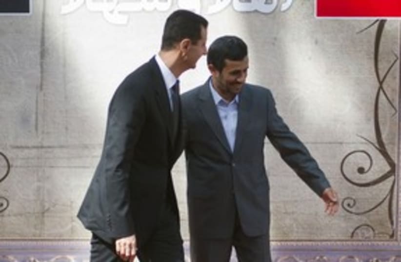 Syrian President Assad, Iranian President Ahmadinejad 311R (photo credit: Morteza Nikoubazl / Reuters)