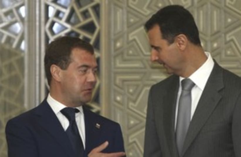 Russian presidident Medvedev with Syria's Assad 311 (R) (photo credit: Khaled Al Hariri / Reuters)
