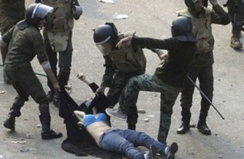 Female protester beaten in Egypt 311 (photo credit: REUTERS/Stringer .)