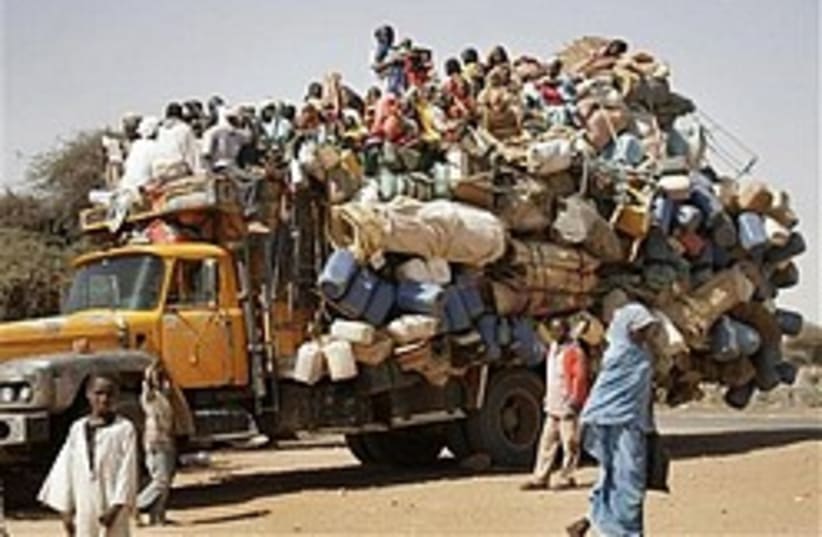 A truck carrying displaced Darfurians in Sudan (photo credit: AP)
