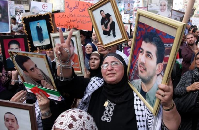 Palestinian woman protesting in Ramllah (a) (photo credit: Marc Israel Sellem)