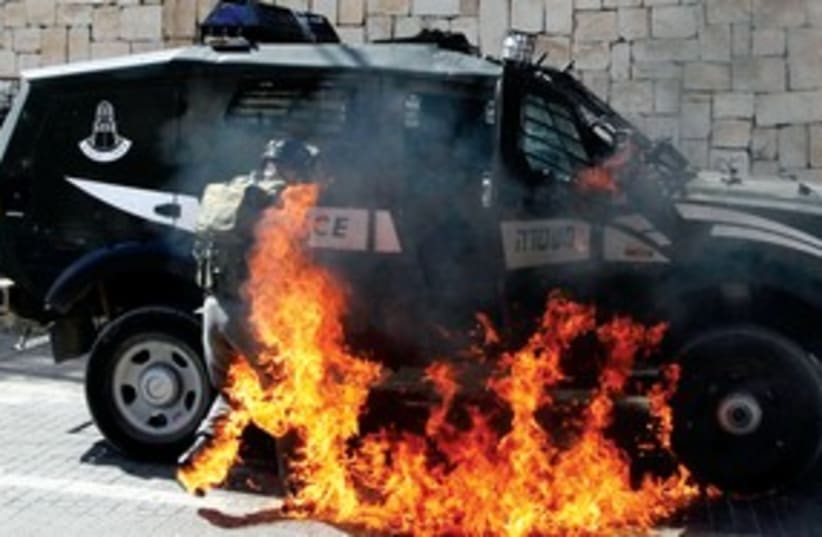 Border police engulfed by flames in Silwan_311 (photo credit: Reuters)