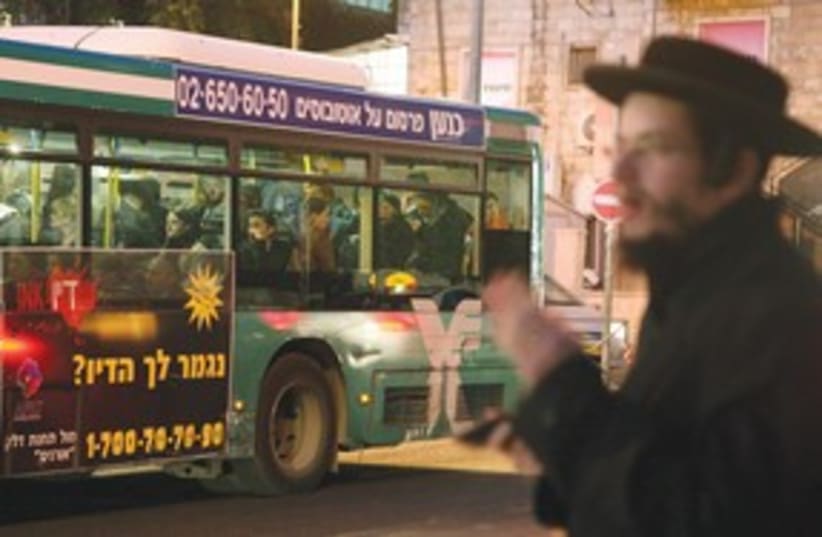 Haredi man near a bus 311 (photo credit: (Marc Israel Sellem/The Jerusalem Post))