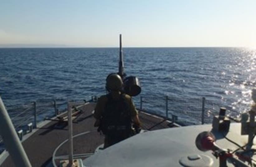Sailor mans cannon during routine patrol of Red Sea 311 (photo credit: Yaakov Katz)