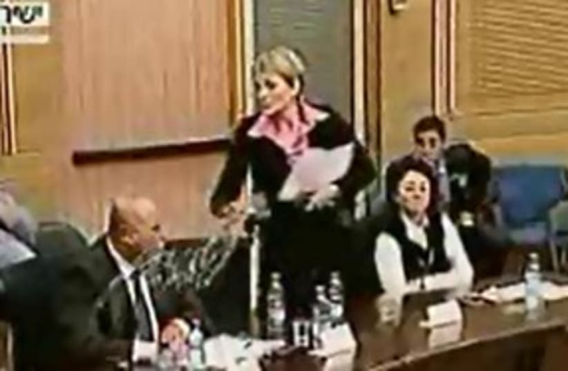 Michalei throws water at Majadele 311 (photo credit: Knesset Channel)