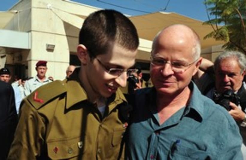 Gilad and Noam Schalit reuniting 311 (R) (photo credit: Reuters))