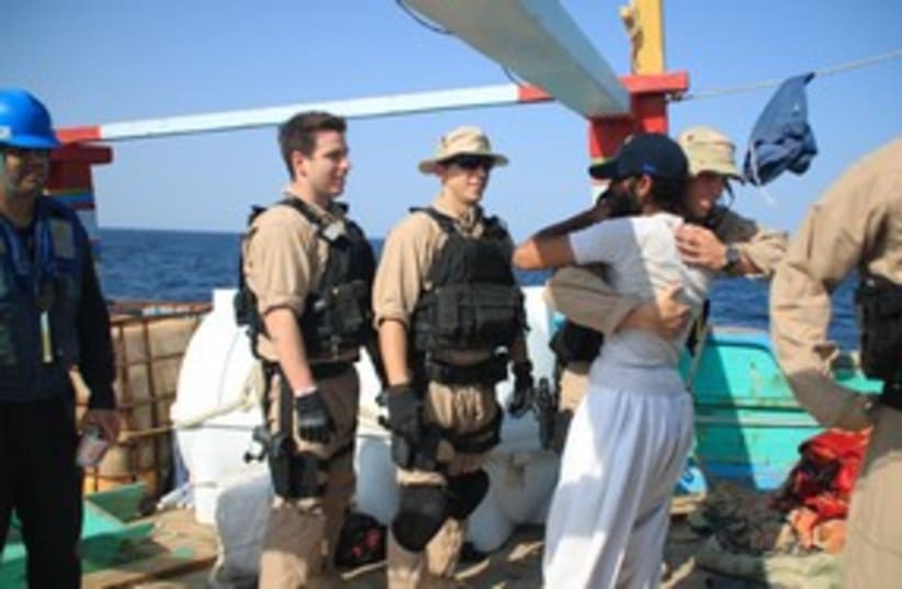 Iranian sailors thank US naval officers after rescue 311 (photo credit: REUTERS/Handout .)