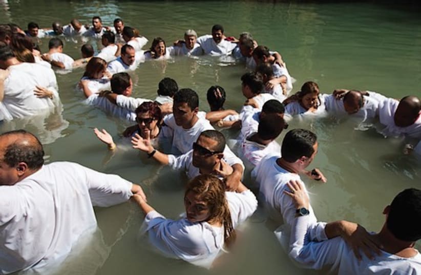 Baptisim ceremony 521 (photo credit: AMIR COHEN / REUTERS)