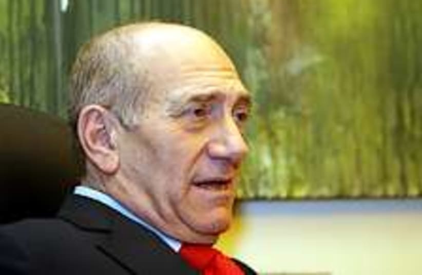 Olmert sits back 224.88 (photo credit: Ariel Jerozolimski)