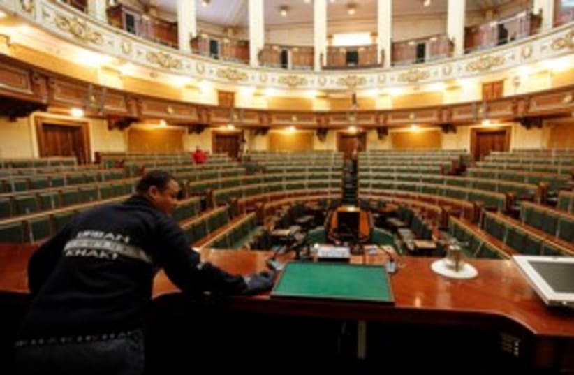 Worker prepares Egypt's parliament in Cairo 311 (R) (photo credit: REUTERS/Mohamed Abd El-Ghany)