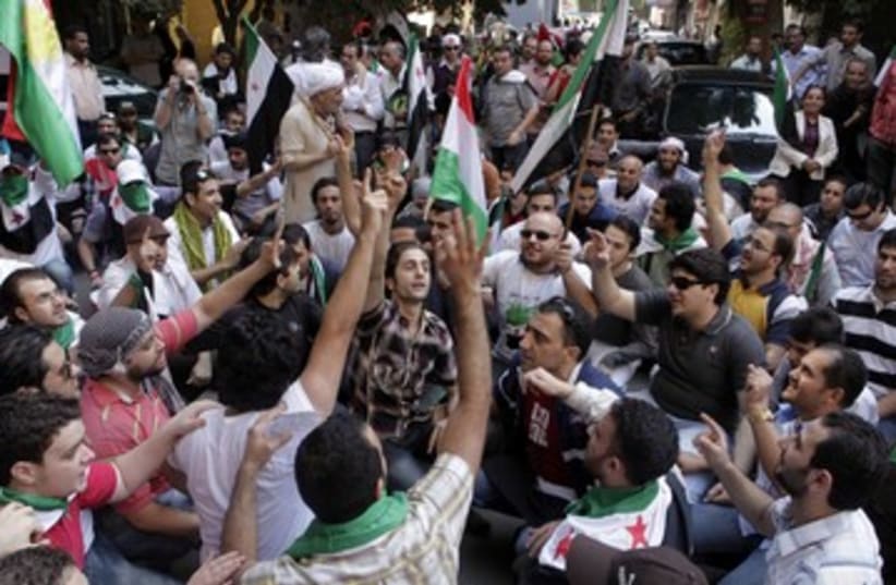 Anti-Assad Syrian protesters outside Cairo embassy 390 R (photo credit: REUTERS)