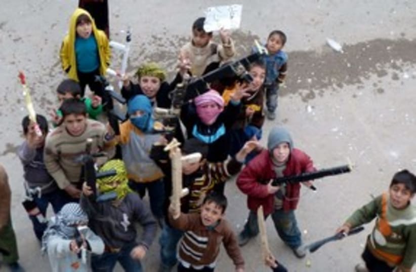 Chldren toy guns protest Syria 311 (photo credit: REUTERS)