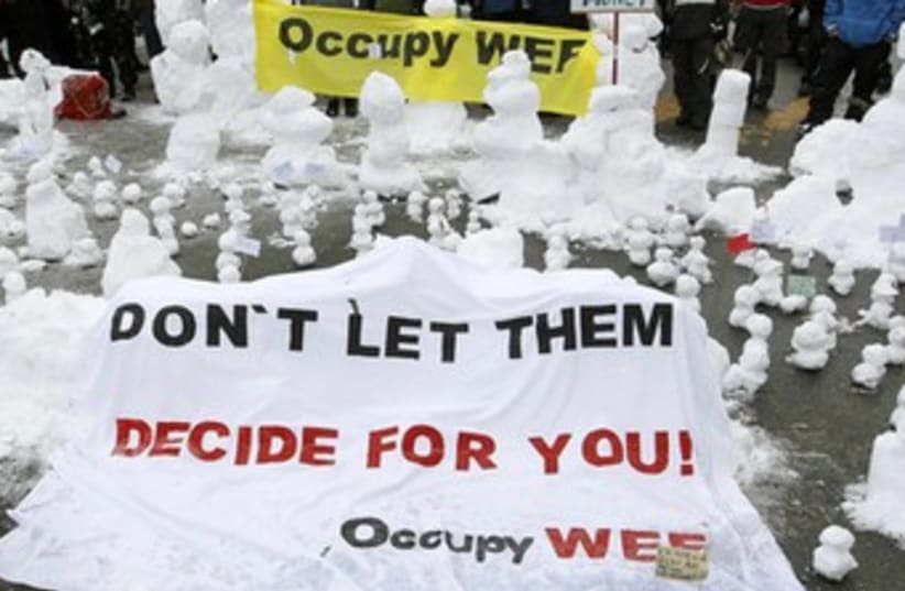 Protesters at WEF (photo credit: REUTERS/Arnd Wiegmann )