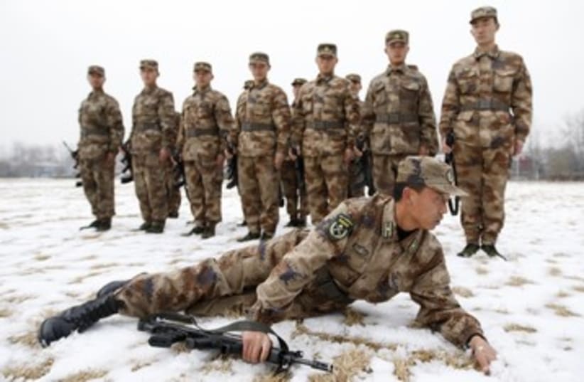 Chinese PLA army soldiers in training 390 (photo credit: 	 REUTERS/China Daily China Daily Information Corp)