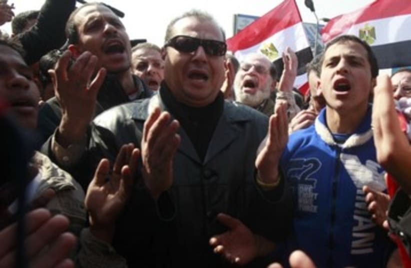 Egyptians protest after Port Said massacre_390 (photo credit: Asmaa Waguih/Reuters)