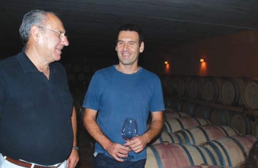 Israel and Golan Flam in their vineyard 521 (photo credit: Courtesy)