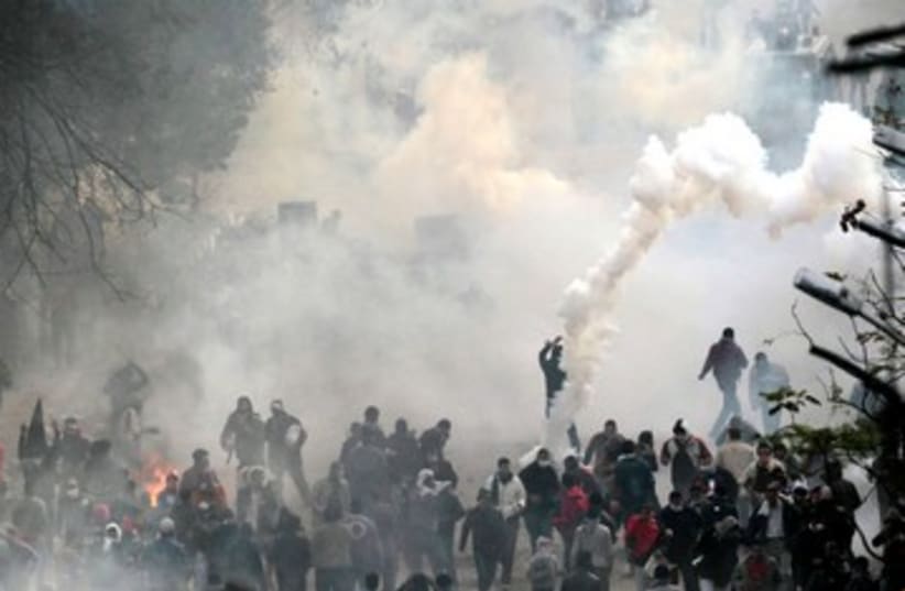 Protesters clash with riot police in Cairo Egypt 390 (R) (photo credit: REUTERS/Mohamed Abd El-Ghany)