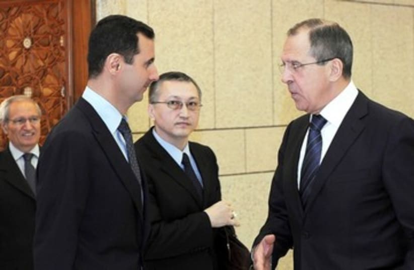 Assad and Lavrov 390 (photo credit: REUTERS)
