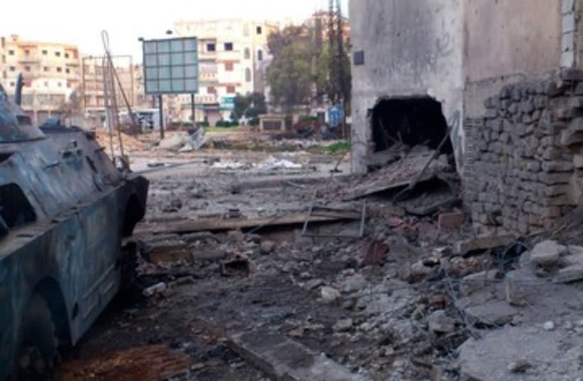 Homs after bombardment 390 (photo credit: REUTERS)