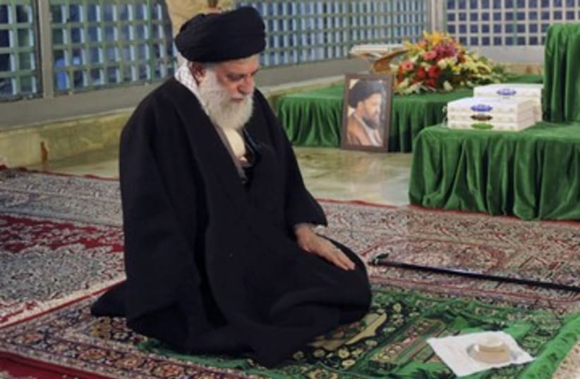 Ayatollah Ali Khamenei prays 390 (photo credit: REUTERS)