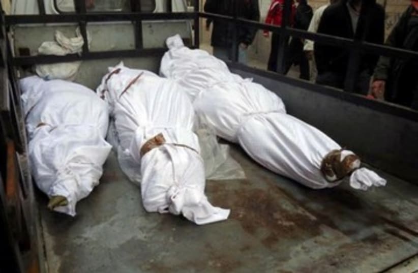 Purported bodies of dead Syrians in Homs_390 (photo credit: Reuters)