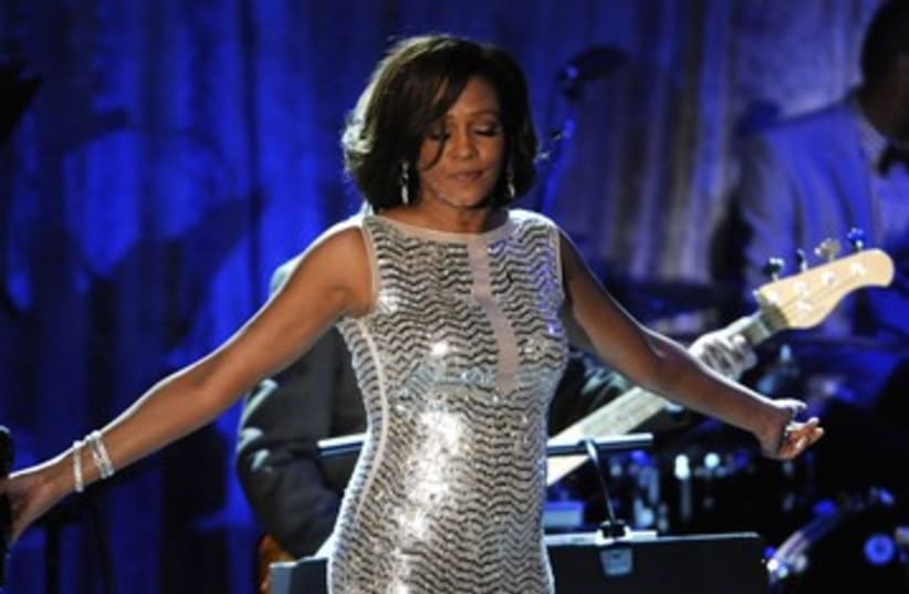 Whitney Houston performs at the Pre-Grammy Gala 390 (photo credit: REUTERS/Phil McCarten)