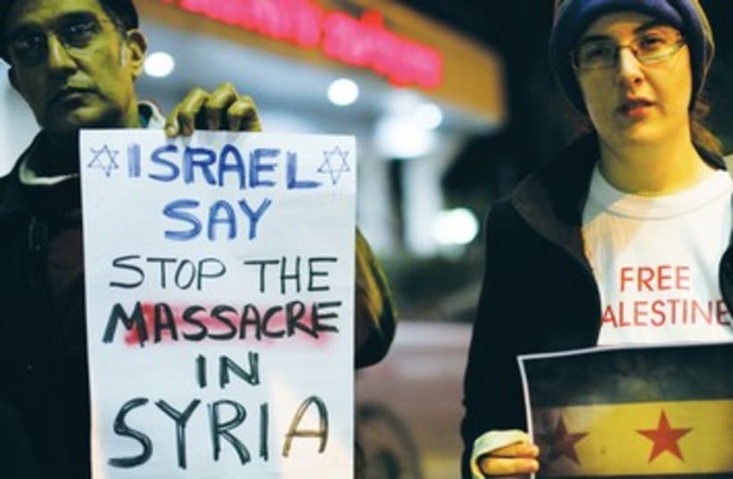 Israelis demonstrate against Assad 390 (photo credit: REUTERS)