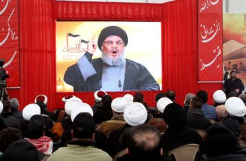 Hezbollah leader Hassan Nasrallah 390 (R) (photo credit: REUTERS/ Ahmad Shalha)