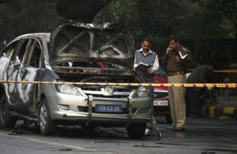 India police inspect car after embassy attack_390 (photo credit: Reuters)