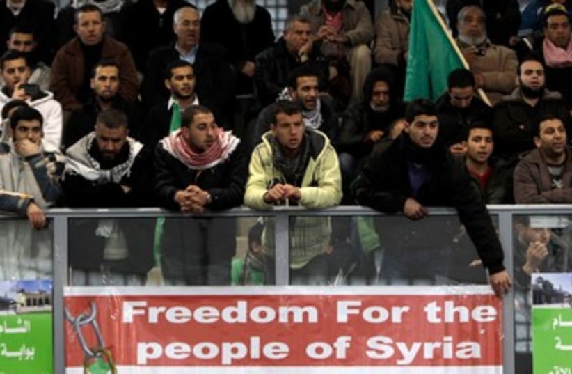 Arab Israelis protest Syrian Assad 390 (photo credit: REUTERS/Ammar Awad)