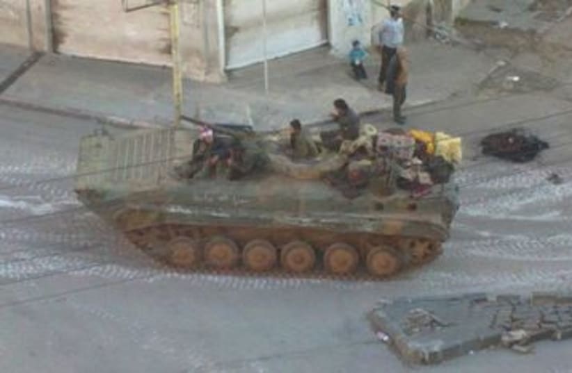 Syrian tank in a Damascus suburb 390 (R) (photo credit: REUTERS/Handout)